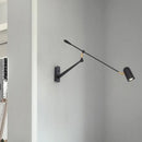 Retractable LED wall light with folding arm