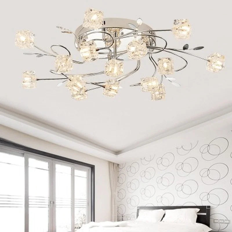 Modern chrome metal chandelier with crystal and LED lighting