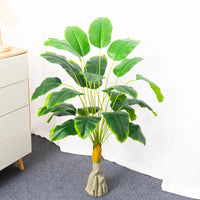 Artificial tropical banana tree with decorative palm leaves