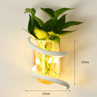 Nordic wooden wall light with green plant for a warm atmosphere