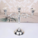 Retro metal three-arm candle holder for events and decorations