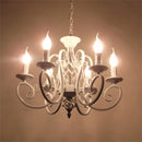 Classic vintage chandelier with 6 or 8 candle lights in wrought iron