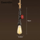 Vintage steampunk pendant light in industrial pipe and hemp rope