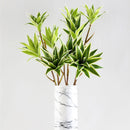 Large artificial bamboo branch with decorative flowers and leaves