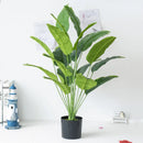 Artificial tropical banana tree with decorative palm leaves