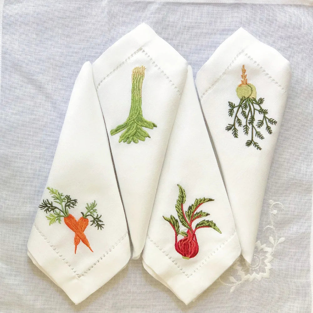 Embroidered linen cotton napkin with vegetable motifs and hemstitch detail