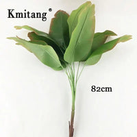 Large artificial monstera and banana plants for indoor decoration