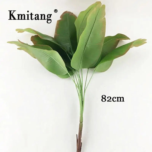 Large artificial monstera and banana plants for indoor decoration
