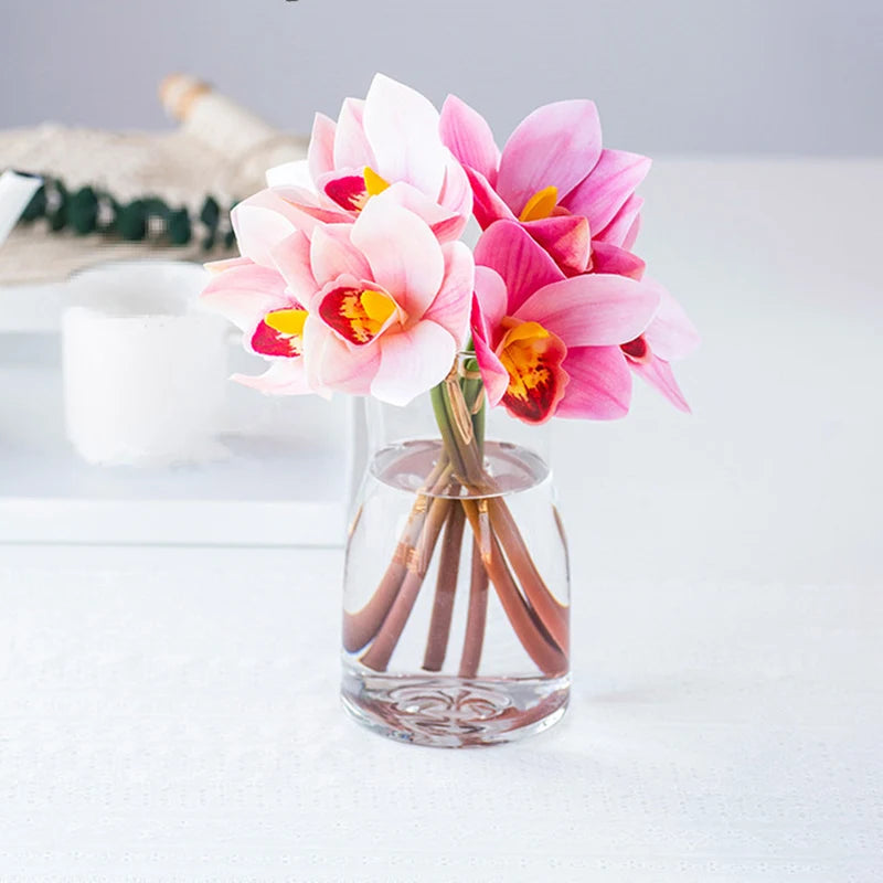 Set of 4 artificial orchid bouquets for festive interior decoration