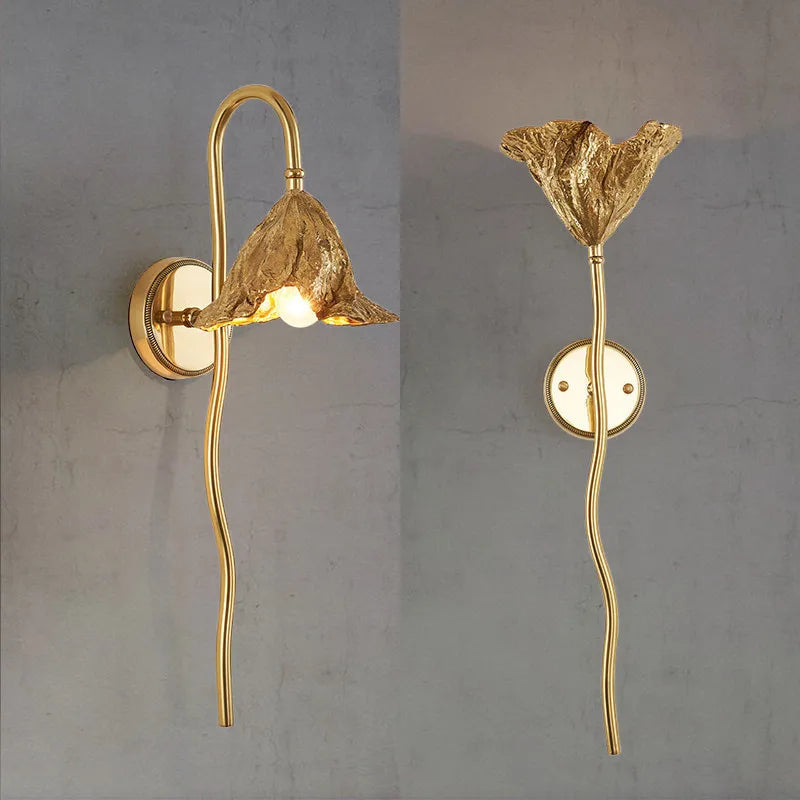Antique brass wall light with decorative lotus design