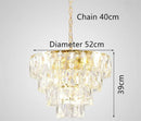 Round gold steel chandelier with crystal and interior LED lighting