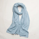 Pure cashmere knitted scarf with elegant winter pompoms