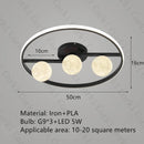 designer ceiling light in black and gold metal with white ball for modern interiors