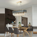 Elegant and modern art deco chandelier in stainless steel and crystal