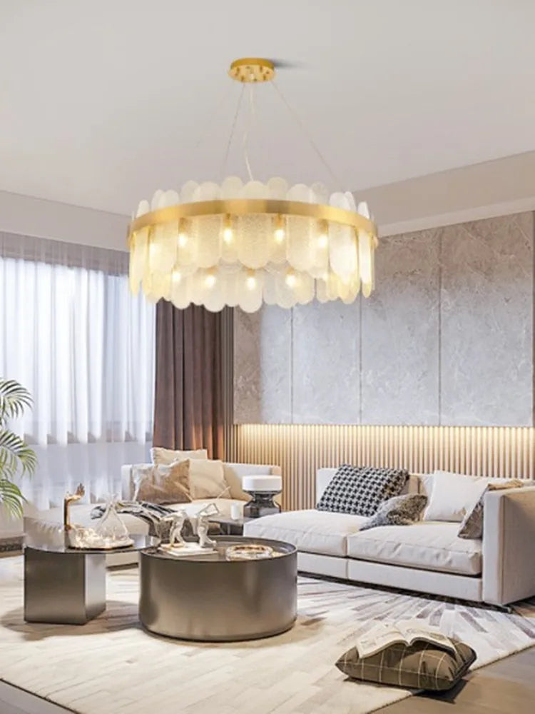 Oval gold metal chandelier with suspended glass shade