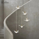 Modern bird pendant light in copper and acrylic