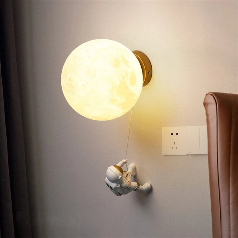 Modern astronaut wall light for children's bedside with star and moon decor