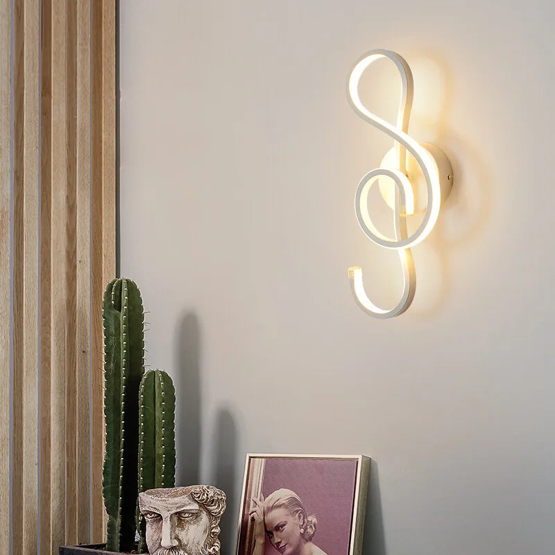 LED wall light in music clef shape