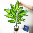 Large artificial tropical plant with leaves for indoor decoration