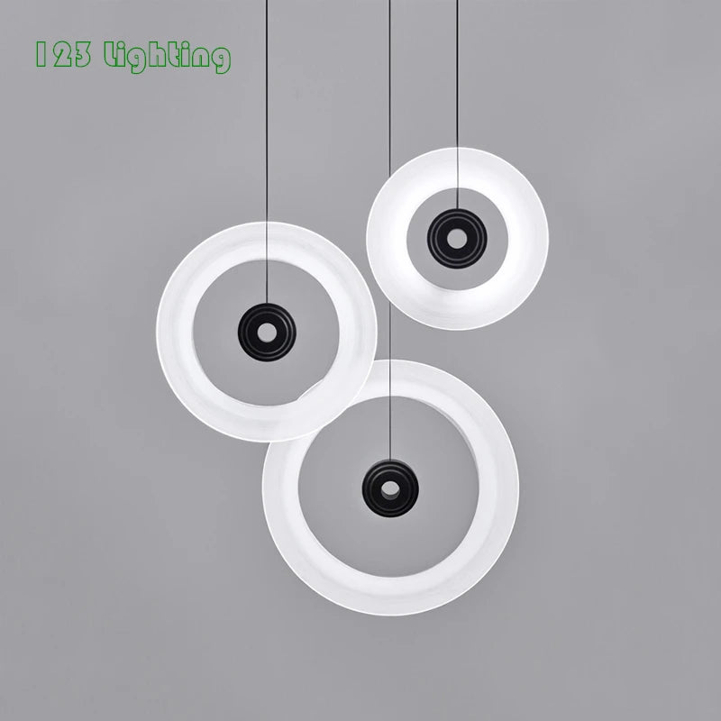 Minimalist round aluminium and glass pendant light for contemporary spaces