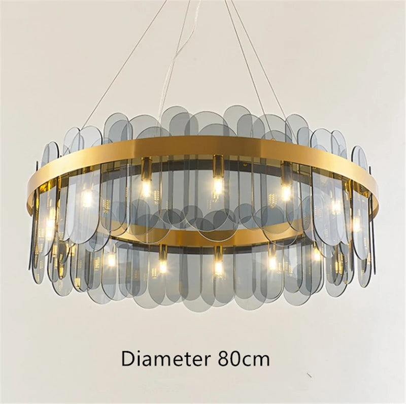 Oval gold metal chandelier with suspended glass shade