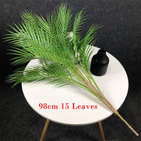 Artificial tropical palm tree with monstera leaves garden decoration