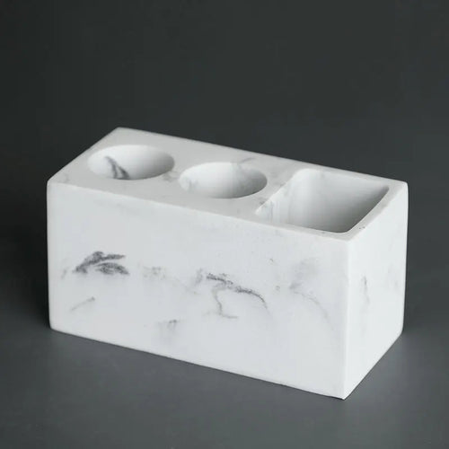 Practical toothbrush and toothpaste organiser