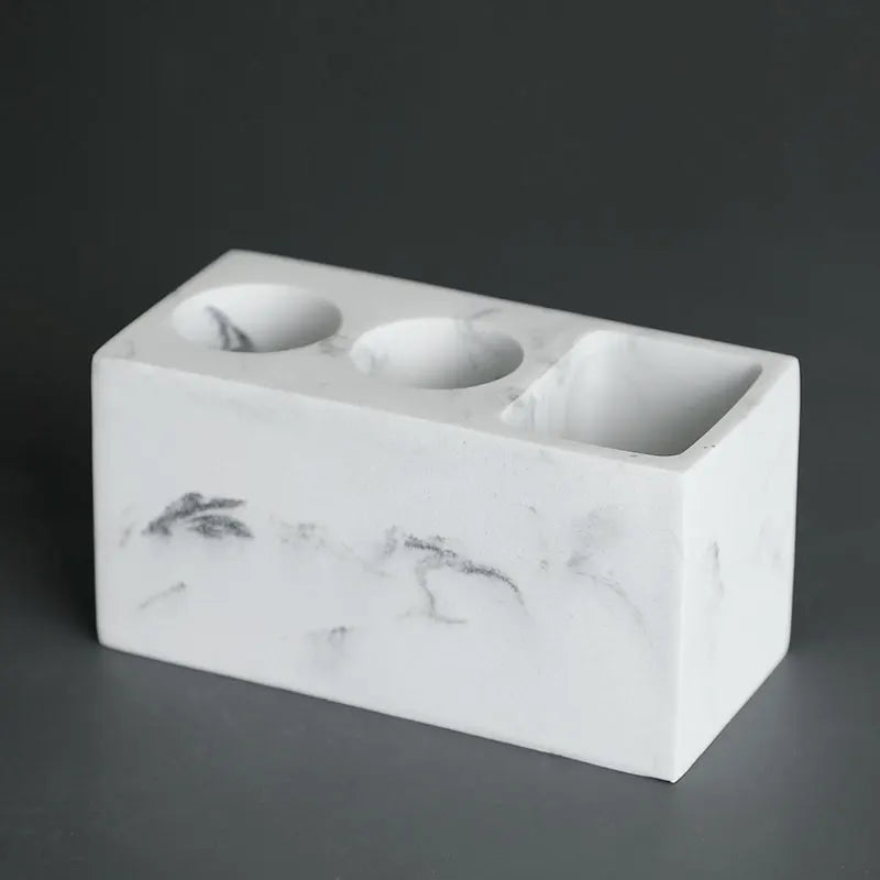 Practical toothbrush and toothpaste organiser