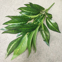 Decorative artificial tropical palm branches plastic