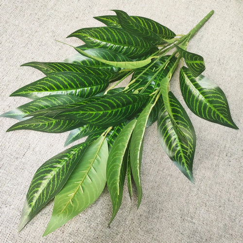 Decorative artificial tropical palm branches plastic