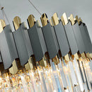 Elegant and modern art deco chandelier in stainless steel and crystal