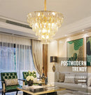 Round gold steel chandelier with crystal and interior LED lighting
