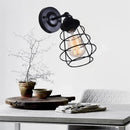 Iron bedside lamp with vintage bulb and switch