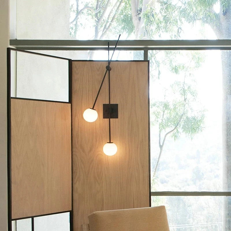 Minimalist glass wall light for modern interiors