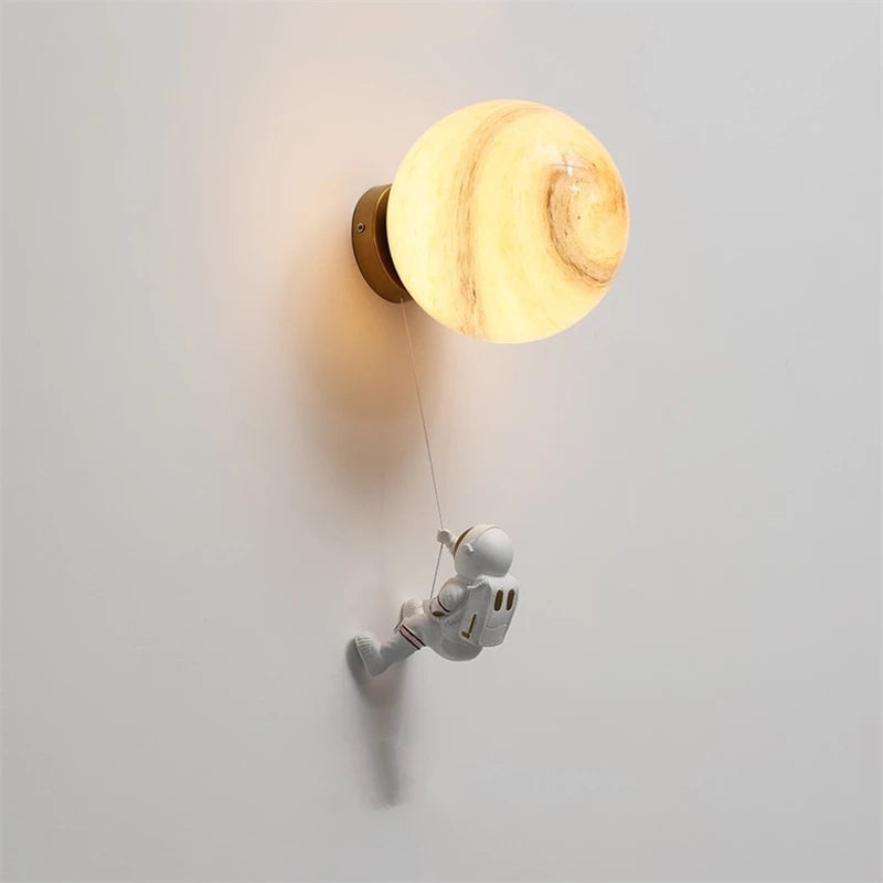 Modern astronaut wall light for children's bedside with star and moon decor
