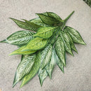 Decorative artificial tropical palm branches plastic