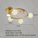 designer ceiling light in black and gold metal with white ball for modern interiors