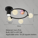 designer ceiling light in black and gold metal with white ball for modern interiors