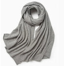 Elegant knitted cashmere scarf with tassels