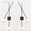 Minimalist glass wall light for modern interiors