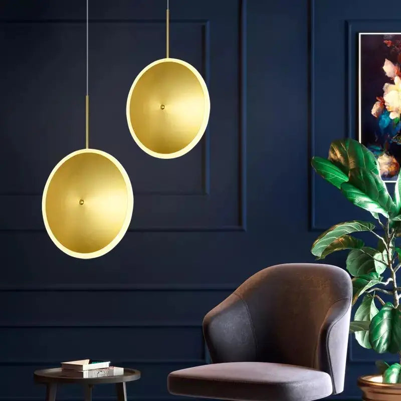 Round gold metal pendant light with ufo design