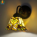 Antique tiffany wall light with floral motif for decorative lighting