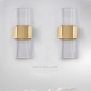 Minimalist stainless steel and crystal wall light