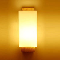 Modern wooden wall light with night light and frosted shade