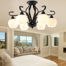 Vintage wrought iron ceiling light with elegant glass shade