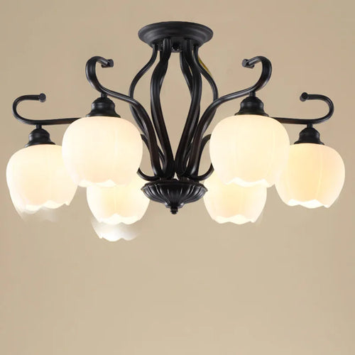 Vintage wrought iron ceiling light with elegant glass shade