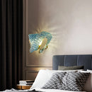 Art deco copper and blue glass wall light with elegant design