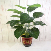 Artificial tropical monstera plant for indoor decoration