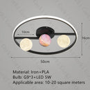 designer ceiling light in black and gold metal with white ball for modern interiors