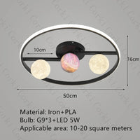 designer ceiling light in black and gold metal with white ball for modern interiors